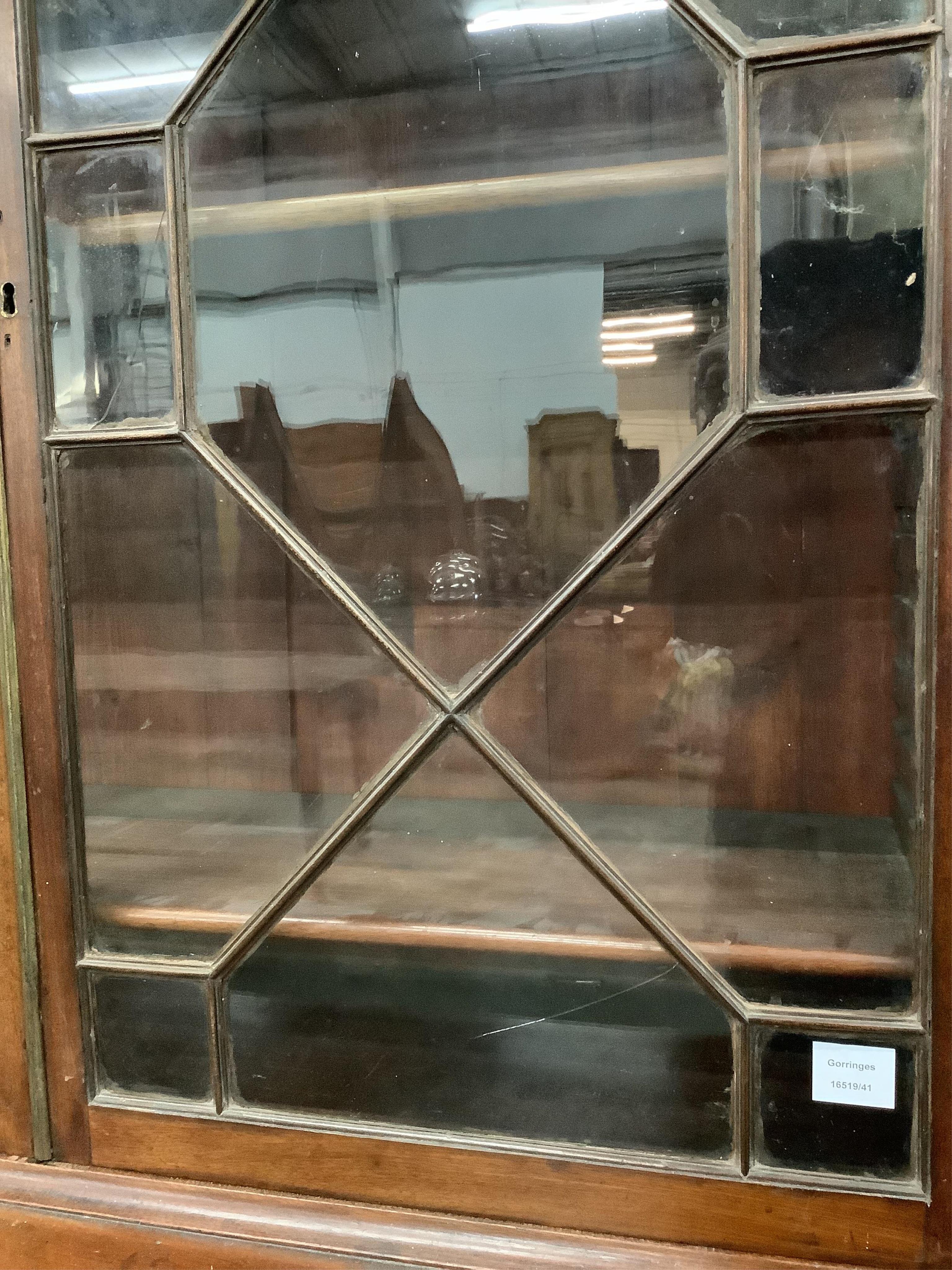 A Regency mahogany secretaire bookcase, width 116cm, depth 58cm, height 217cm. Condition - fair, two glass panes cracked